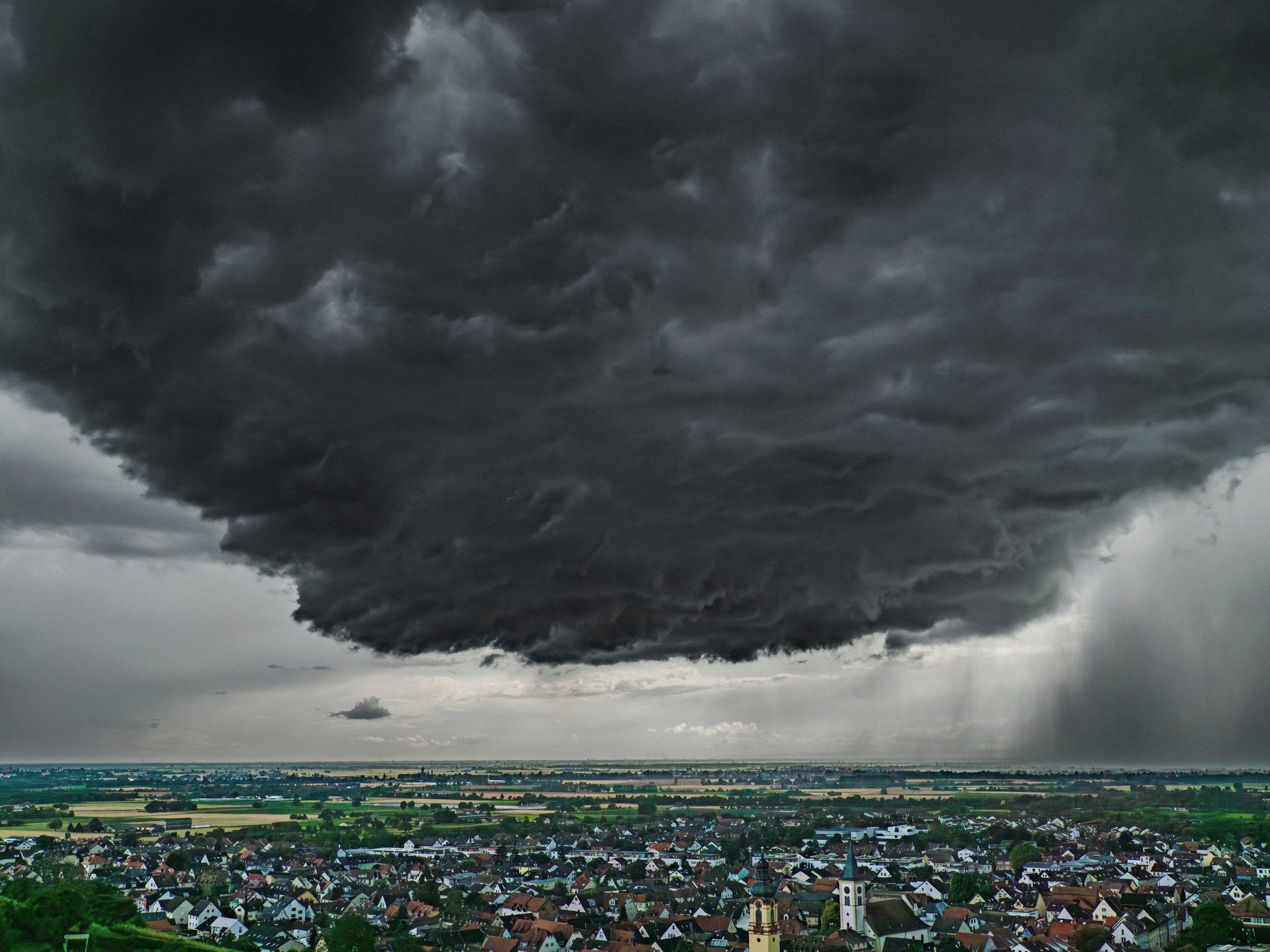 Storm cloud over a town seen from above